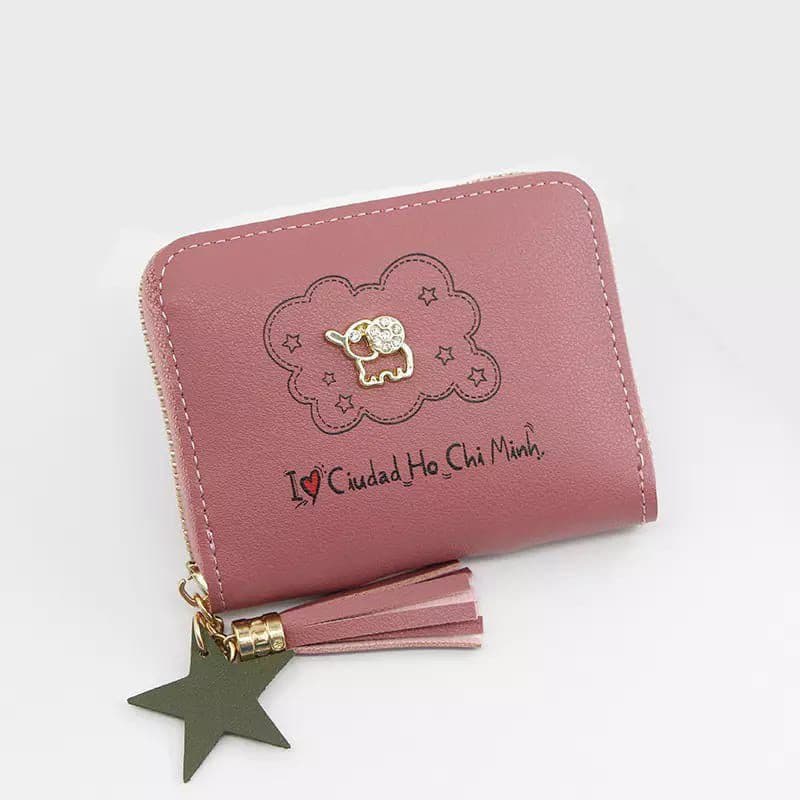Dompet mini warna peach background putih dengan gambar gajah mini berwarna emas
