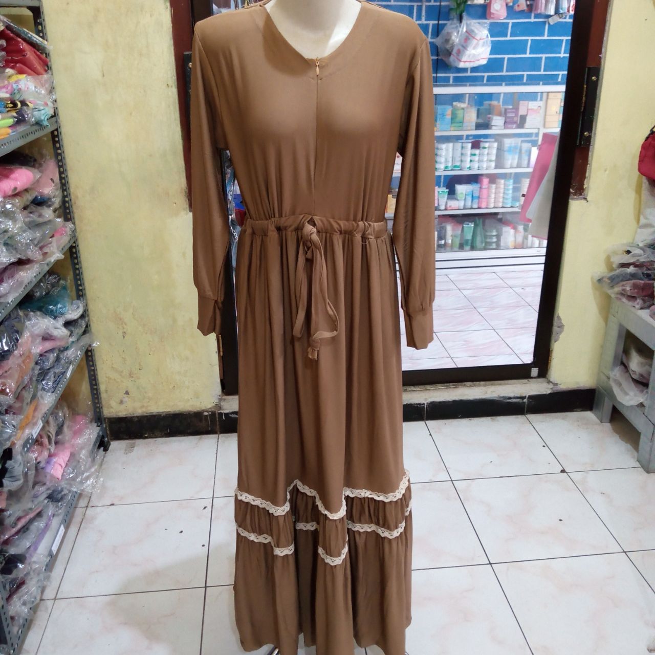 ini adalah Gamis Jersey Syafira Milo, size: 104 cm x 135 cm, material: Jersey, color: Chocholate milo, brand: Gamisindonesia, age_group: all ages, gender: female