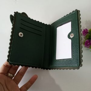 Ini adalah Dompet Renda Kelinci Hijau size: Mini, material: sintetis, color: green, brand: dompetrendabojonegoro, age_group: all ages, style: simple teen wallet, gender: female, pattern: embroidered leather with a rabbit pattern,