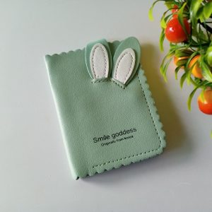 Ini adalah Dompet Renda Kelinci Mint size: Mini, material: sintetis, color: green mint, brand: dompetrendabojonegoro, age_group: all ages, style: simple teen wallet, gender: female, pattern: embroidered leather with a rabbit pattern,