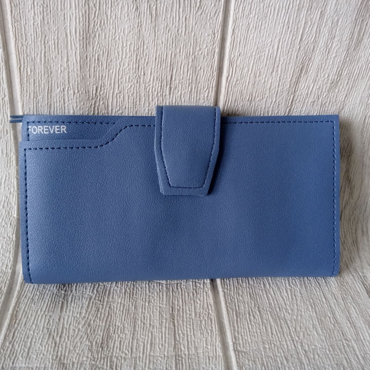 Ini adalah Dompet D26 Panjang Biru Muda size: 18cmx9cm, material: synthetic leather, color: blue, brand: dompetd26bojonegoro, age_group: all ages, style: simple long wallet, gender: female, pattern: leather d26,