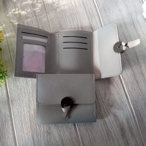 Ini adalah Dompet 17A Abu Muda size: 11 cm x 9.5 cm, material: synthetic leather, color: grey, brand: dompet17Abjn, age_group: all ages, style: casual style, gender: female, pattern: plain,